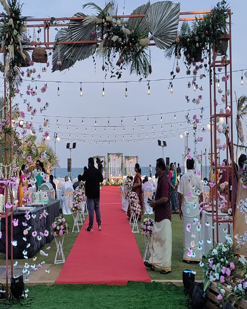 Outdoor Wedding Setup with Floral Decor and String Lights