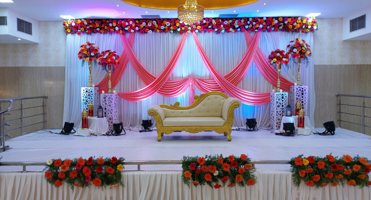 Grand wedding stage decoration in Chennai with elegant floral and lighting design.