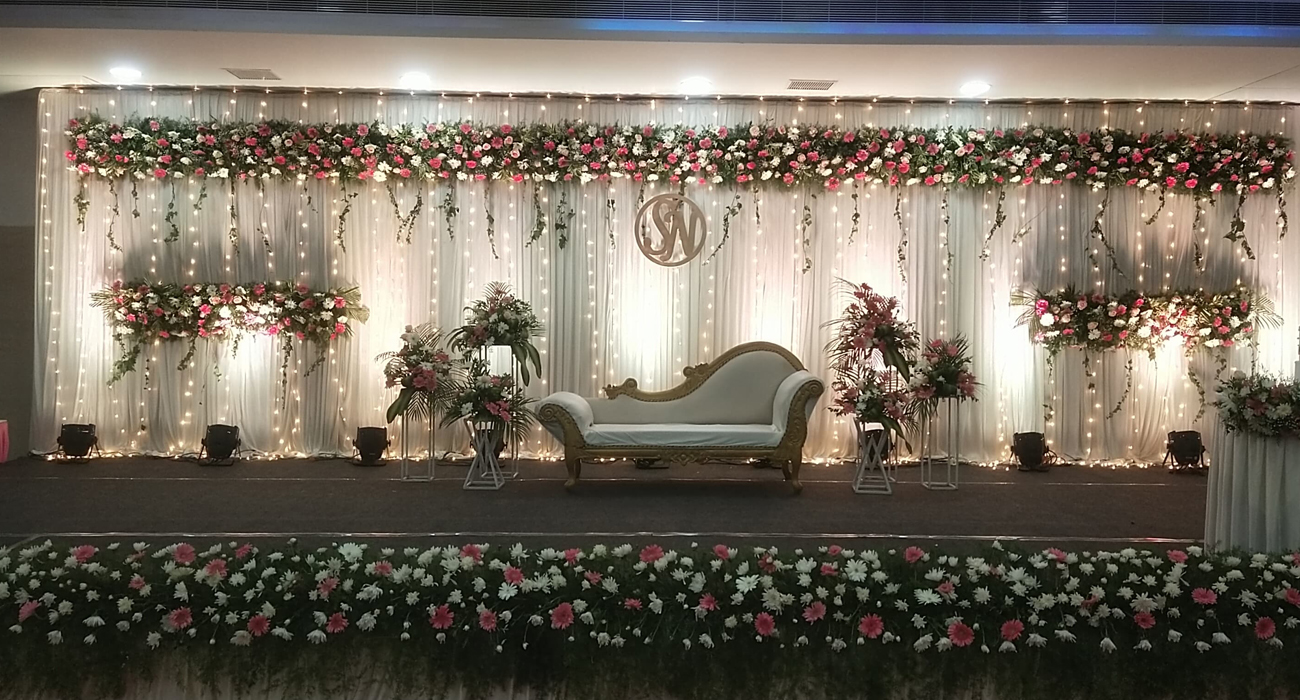 Stunning reception stage decoration in Chennai featuring modern and traditional themes.